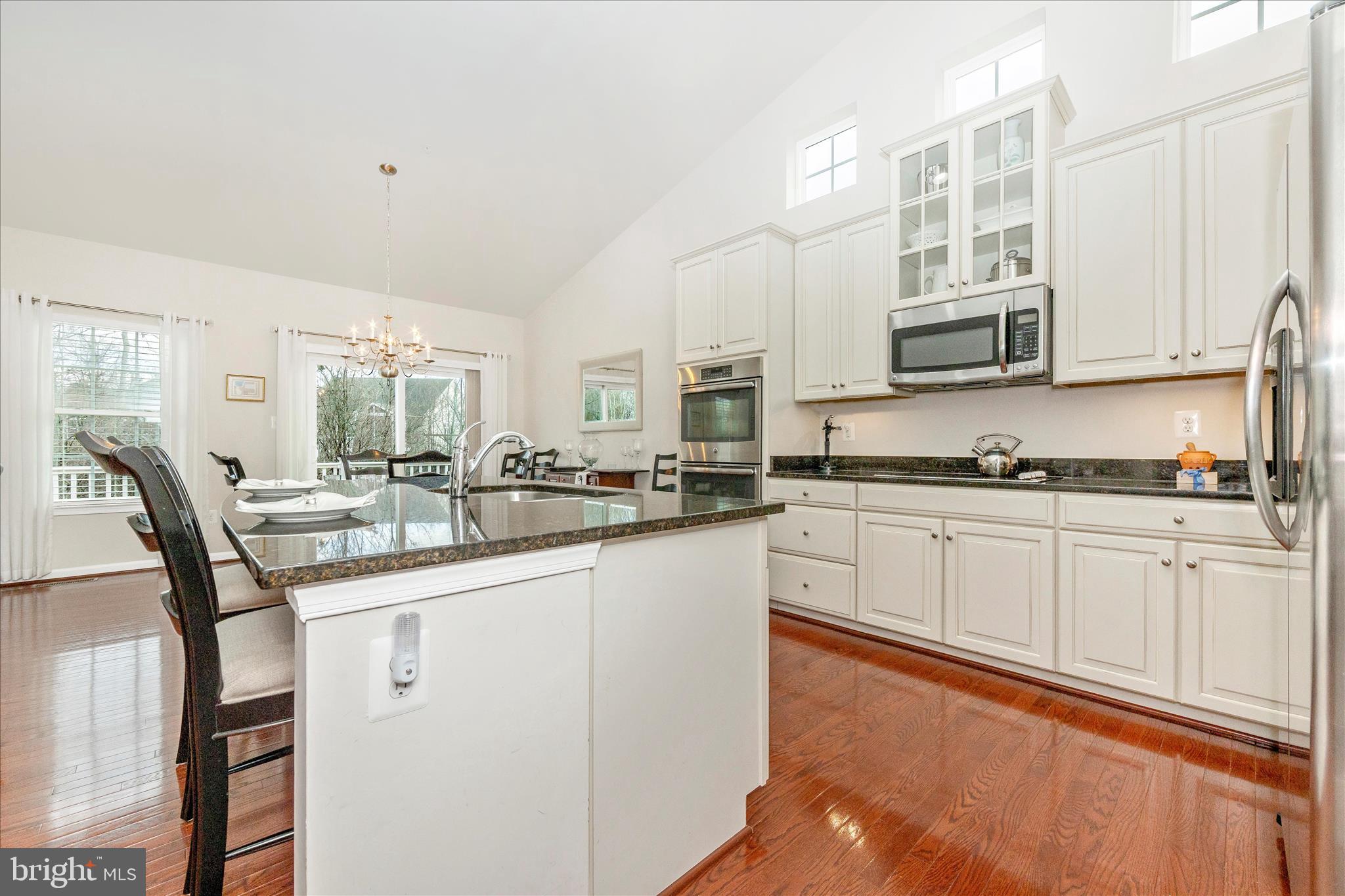 5903 Constance Way New Market, MD 21774 - Photo 10 of 53 a kitchen with stainless steel appliances granite countertop a sink and cabinets
