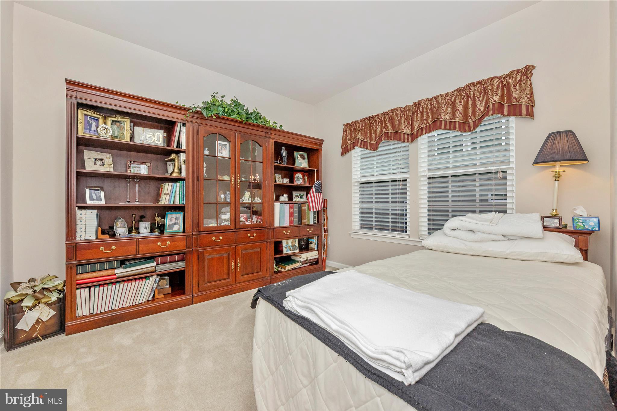 5903 Constance Way New Market, MD 21774 - Photo 21 of 53 a bed sitting in a bedroom next to a book shelf