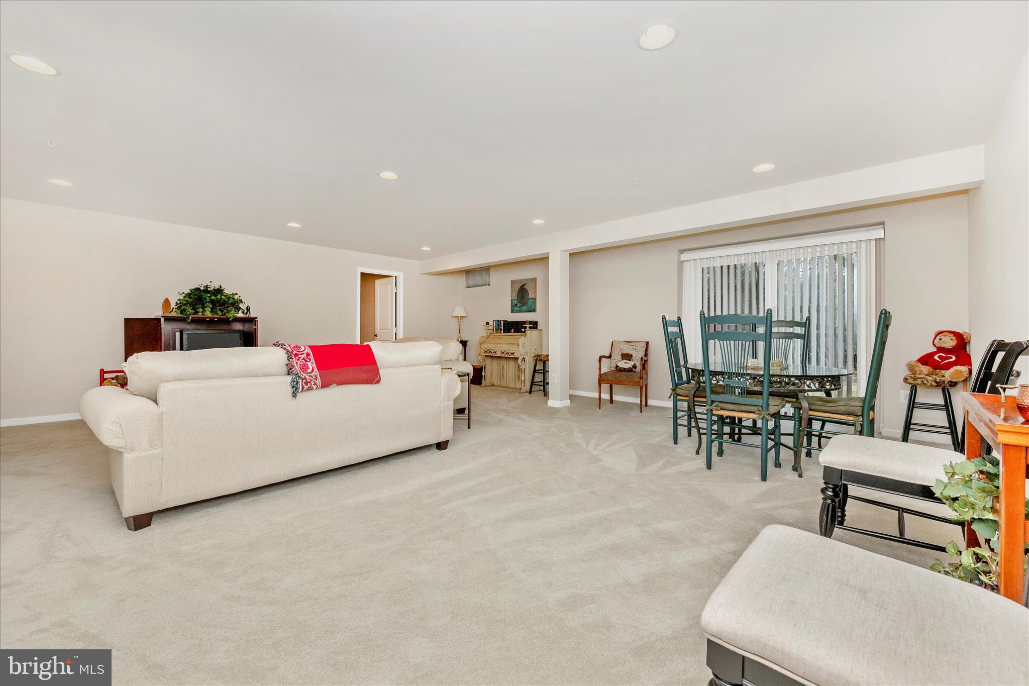 5903 Constance Way New Market, MD 21774 - Photo 28 of 53 a living room with furniture and a dining table with window