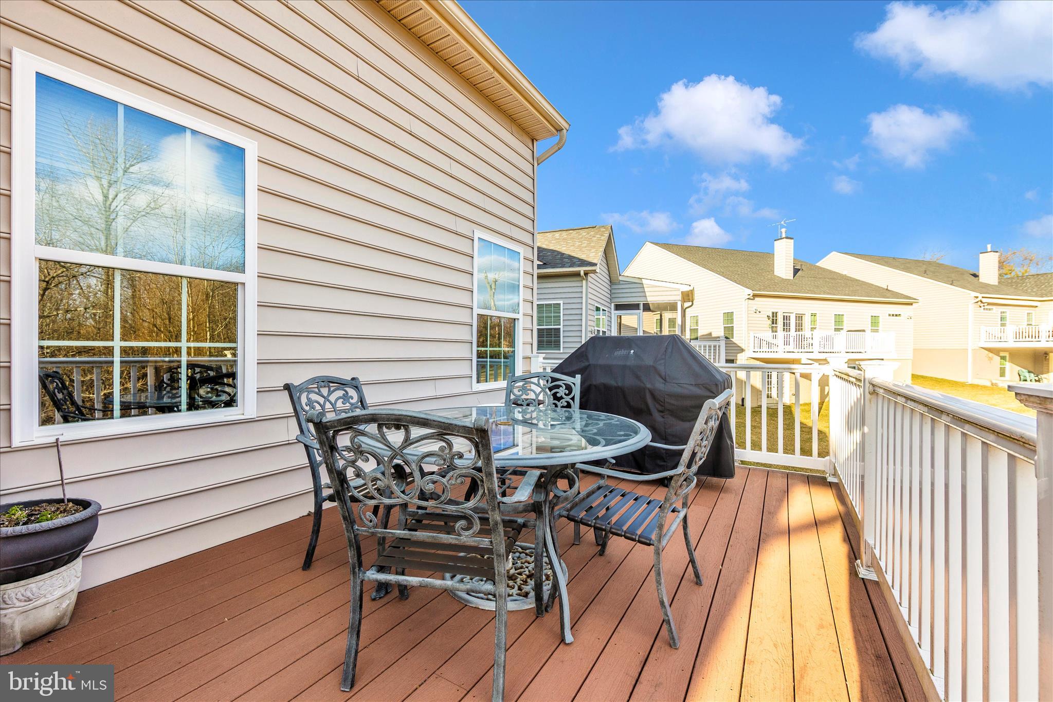 5903 Constance Way New Market, MD 21774 - Photo 39 of 53 a view of a deck with table and chairs and wooden floor