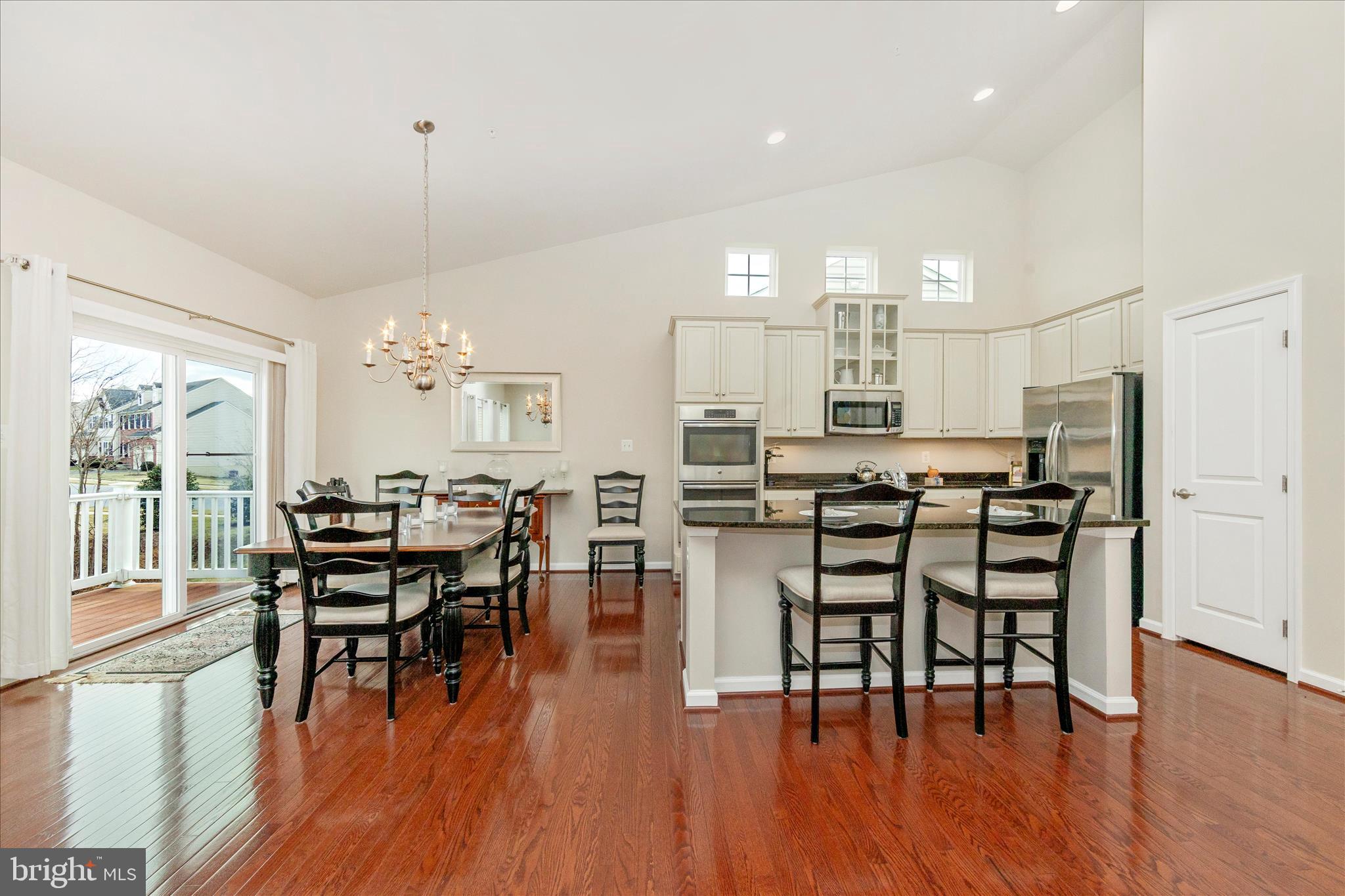 5903 Constance Way New Market, MD 21774 - Photo 4 of 53 a view of a dining room with furniture and wooden floor
