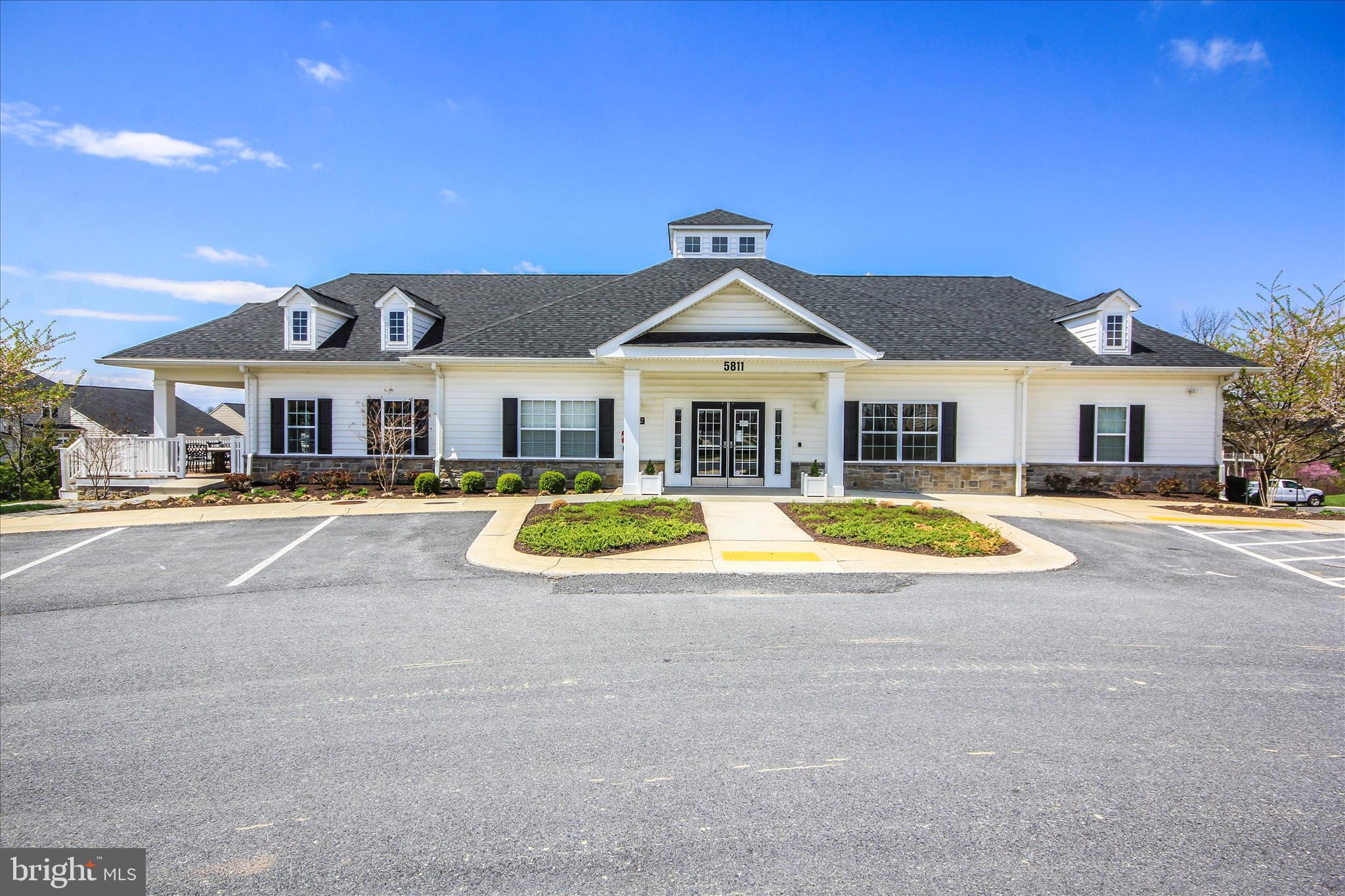 5903 Constance Way New Market, MD 21774 - Photo 46 of 53 a view of a white house with a large pool and a yard