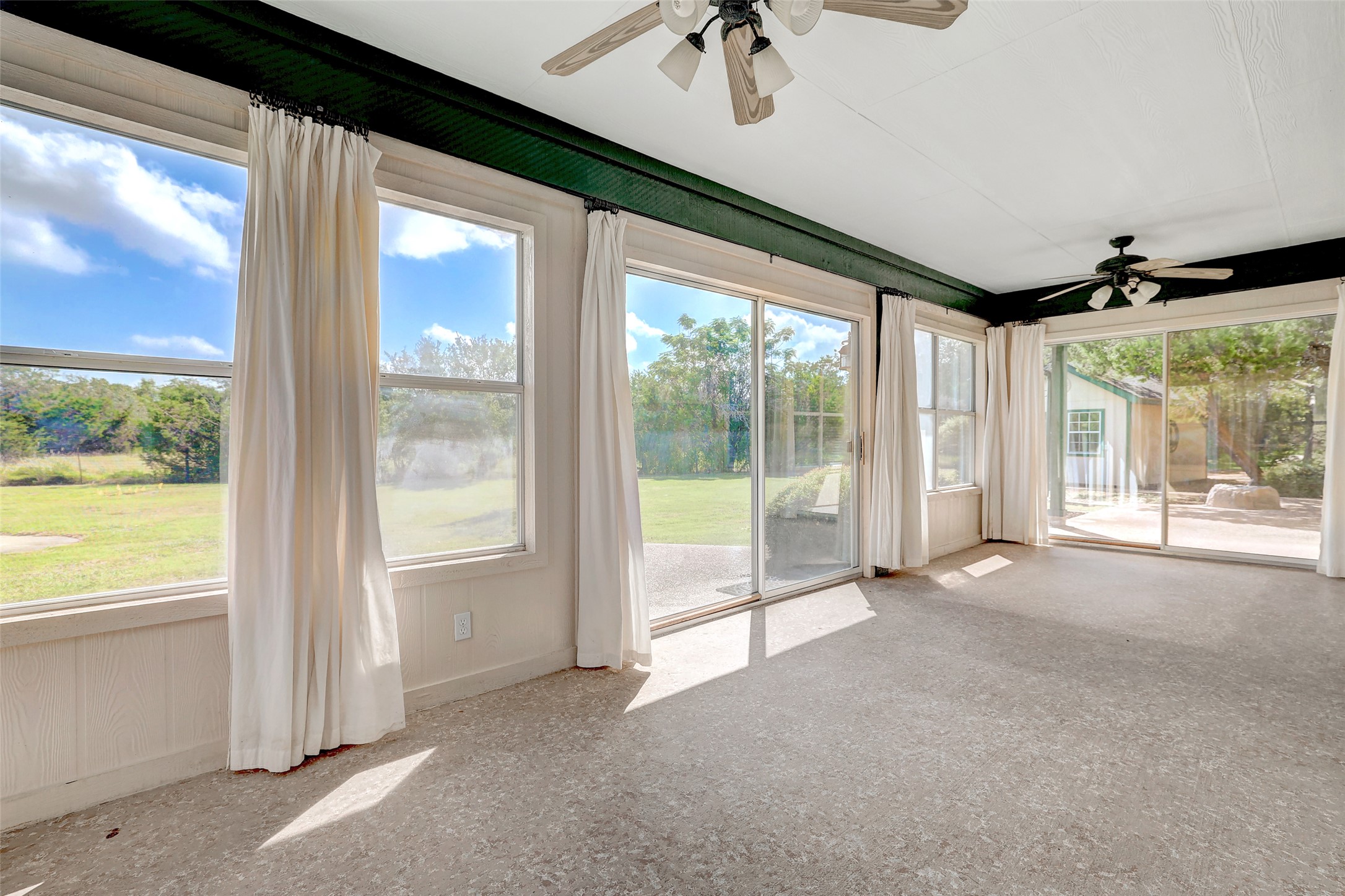 125 Kyle Lane Georgetown, TX 78633 - Photo 30 of 34 Unfurnished sunroom with a ceiling fan