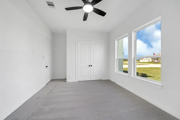 a view of an empty room with a window