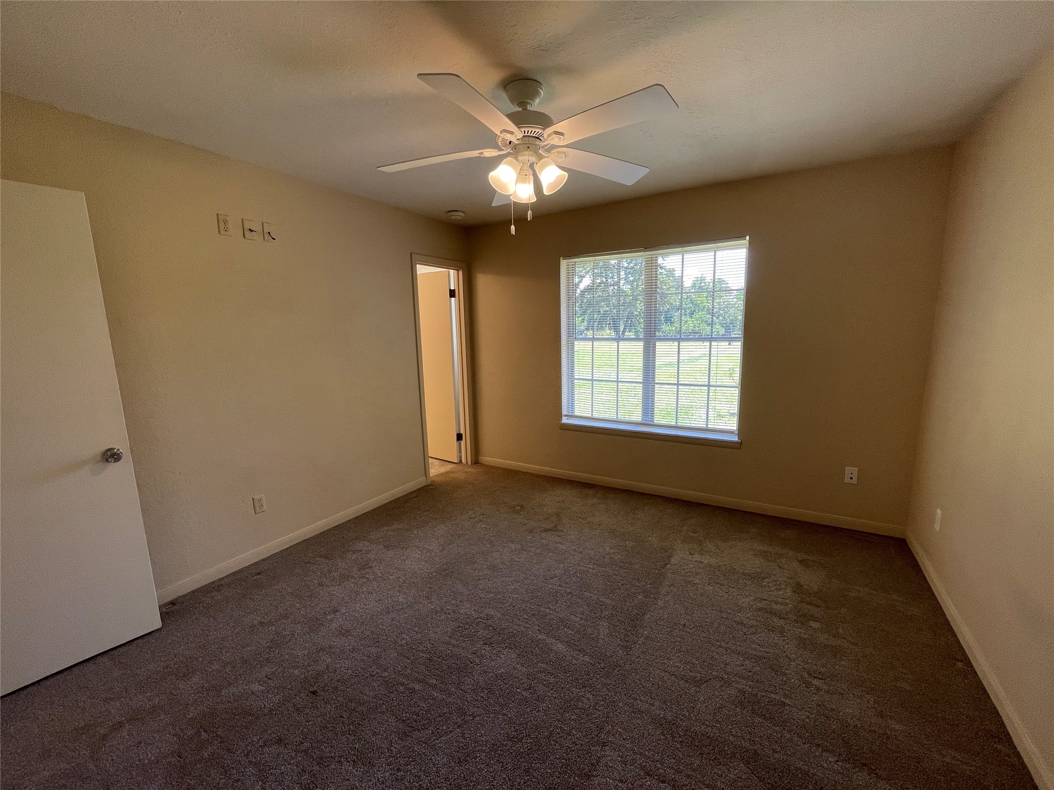 19439 Keenan Cut Off Road Montgomery, TX 77316 - Photo 30 of 39 Back bedroom offers direct access to a convenient secondary 1.5 bathroom, blending comfort and practicality for seamless living.