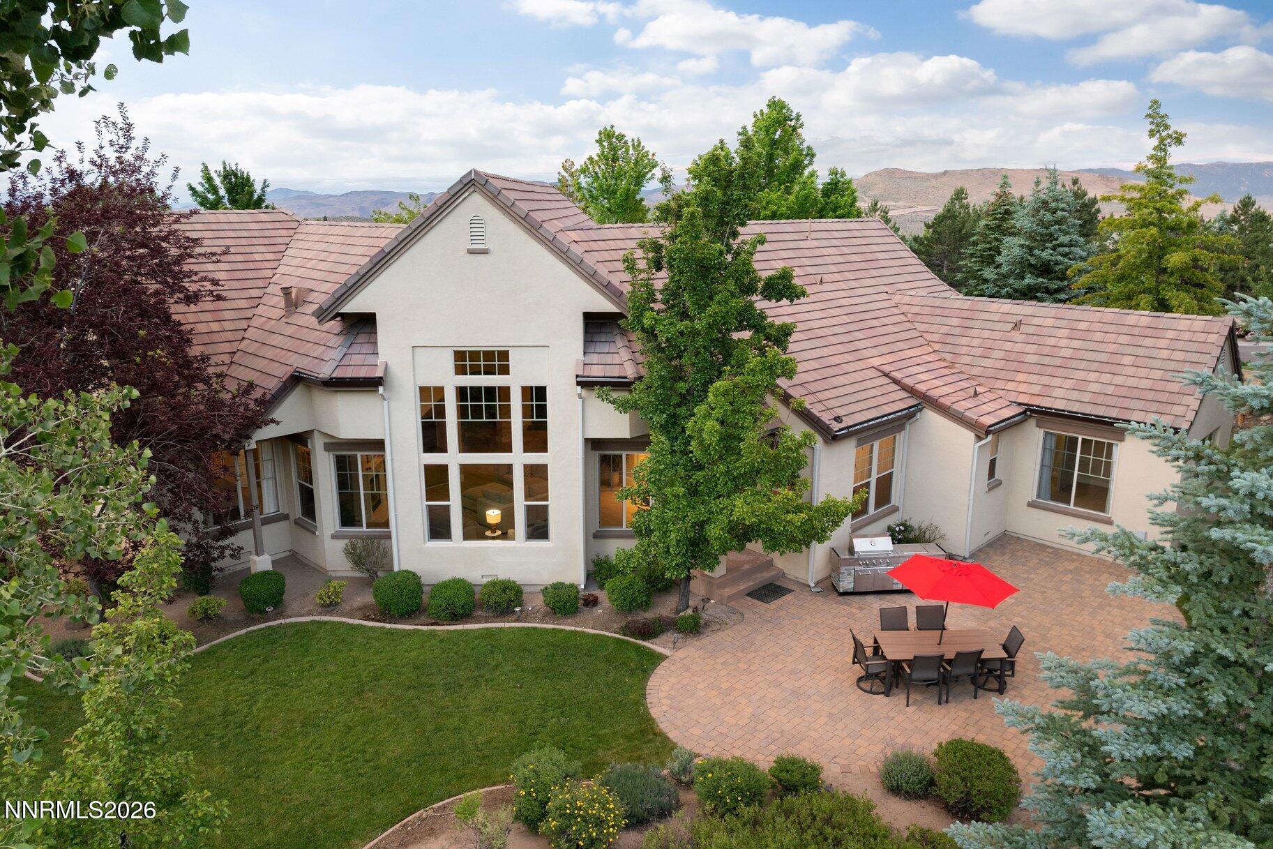 16925 Rue Du Parc Reno, NV 89511 - Photo 33 of 34 a aerial view of a house with a yard and potted plants