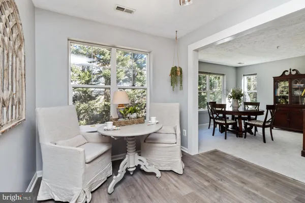 a kitchen with a table and chairs