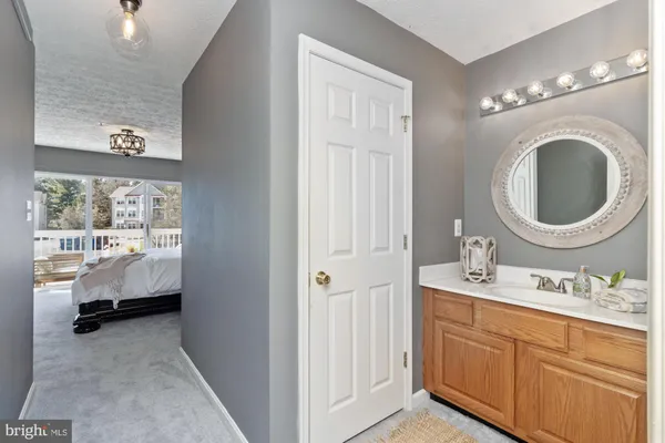 a white toilet sitting next to a shower