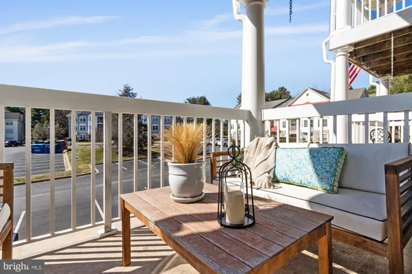 a view of a balcony with chairs