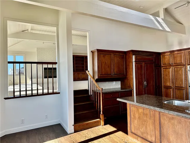 a kitchen with stainless steel appliances granite countertop a stove and a microwave
