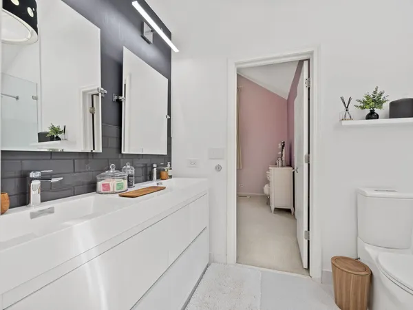 a bathroom with a sink a toilet and bathtub