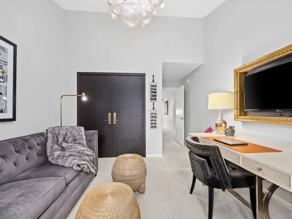 a bedroom with a workspace