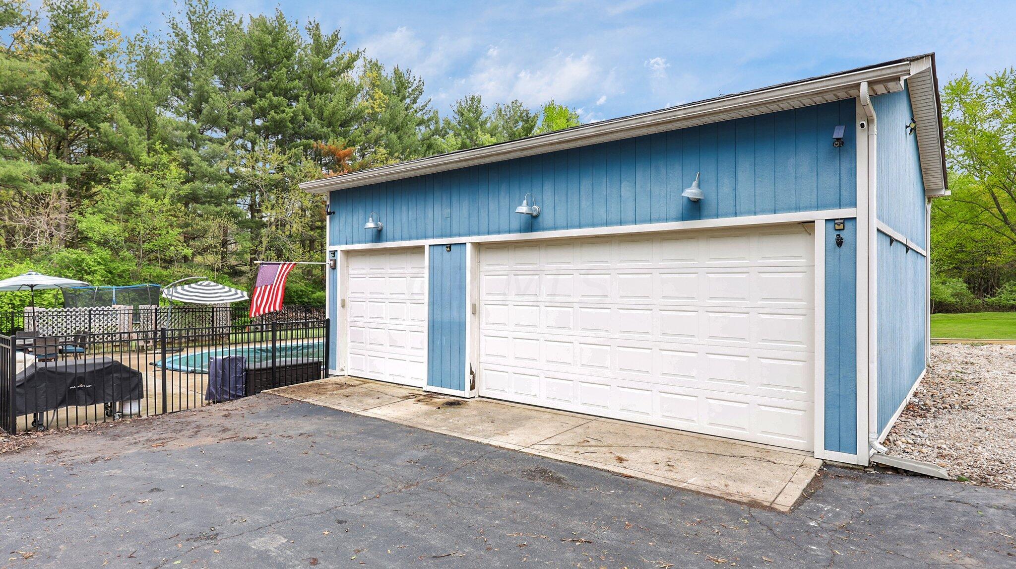 7790 Schott Road Westerville, OH 43081 - Photo 44 of 50 3-car oversized detached garage with loft storage to DOUBLE your usable storage space and STILL be able to park 3 cars!