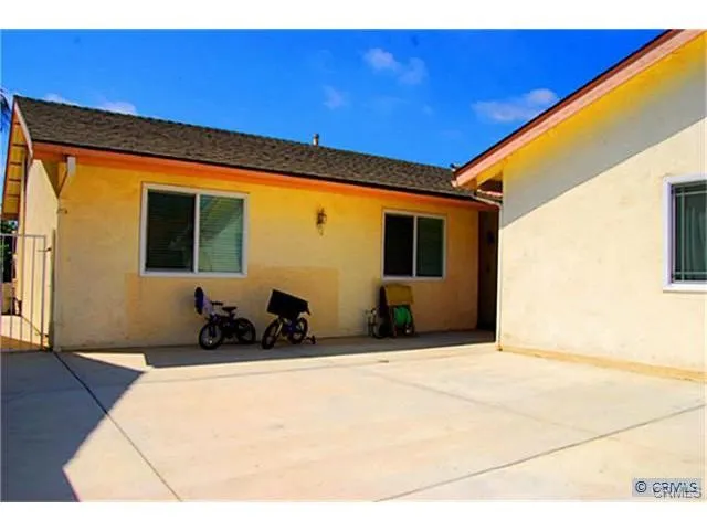 a front view of a house with large windows