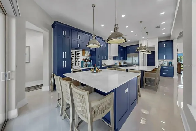 a kitchen with stainless steel appliances granite countertop lots of counter top space