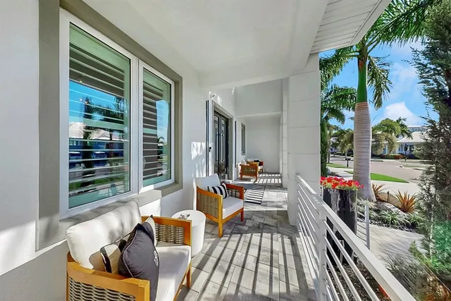 a view of a livingroom with furniture and a large window