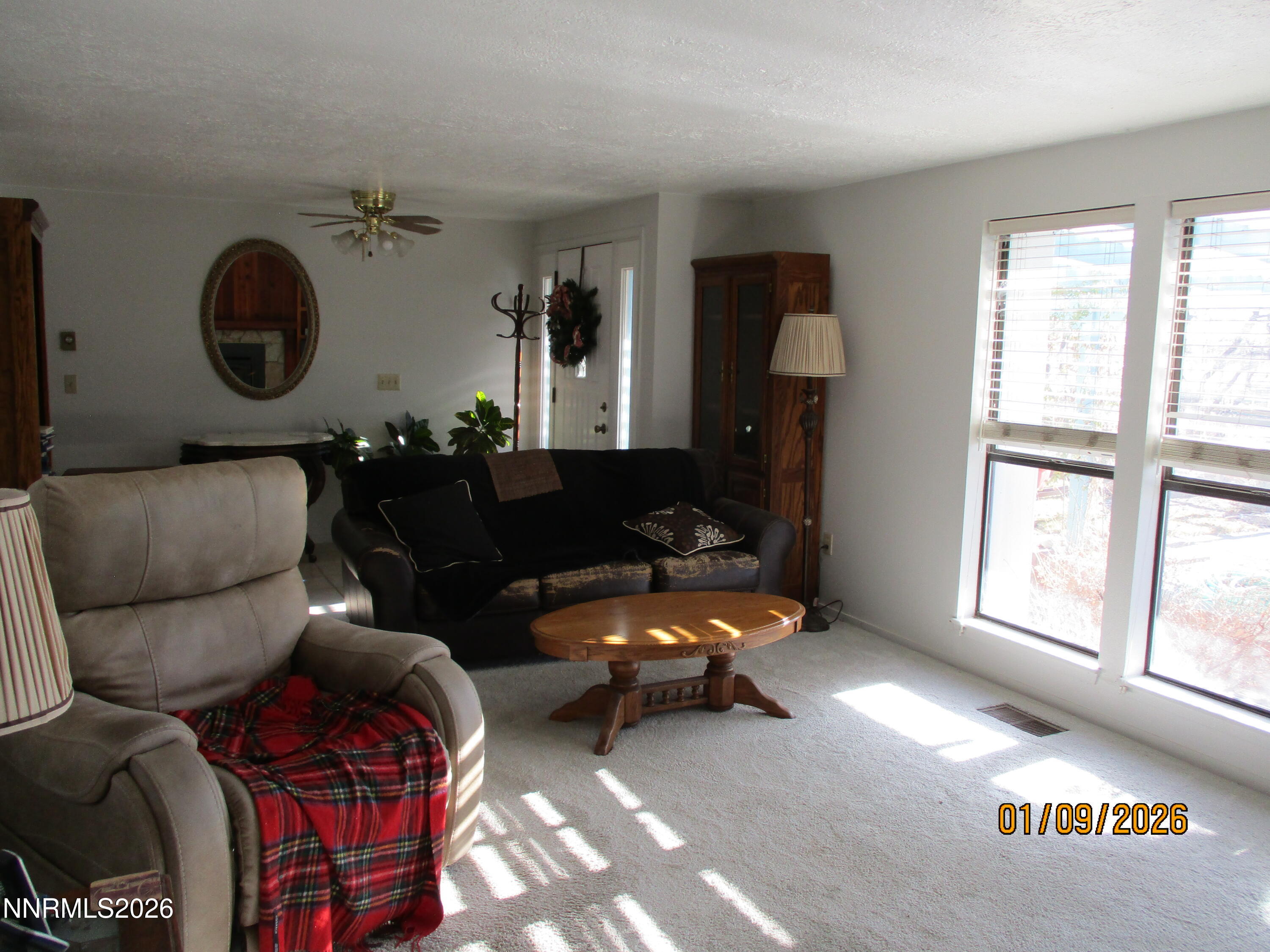 13405 Chimney Dam Road Paradise Valley, NV 89426 - Photo 20 of 90 a living room with furniture and a large window