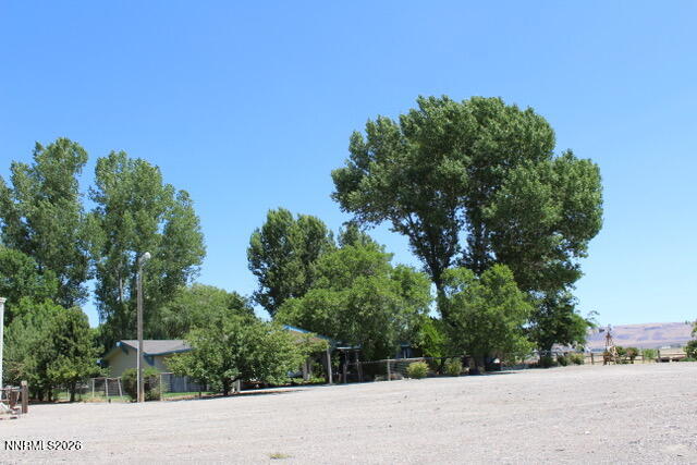 13405 Chimney Dam Road Paradise Valley, NV 89426 - Photo 2 of 90 a view of a rural road with plants
