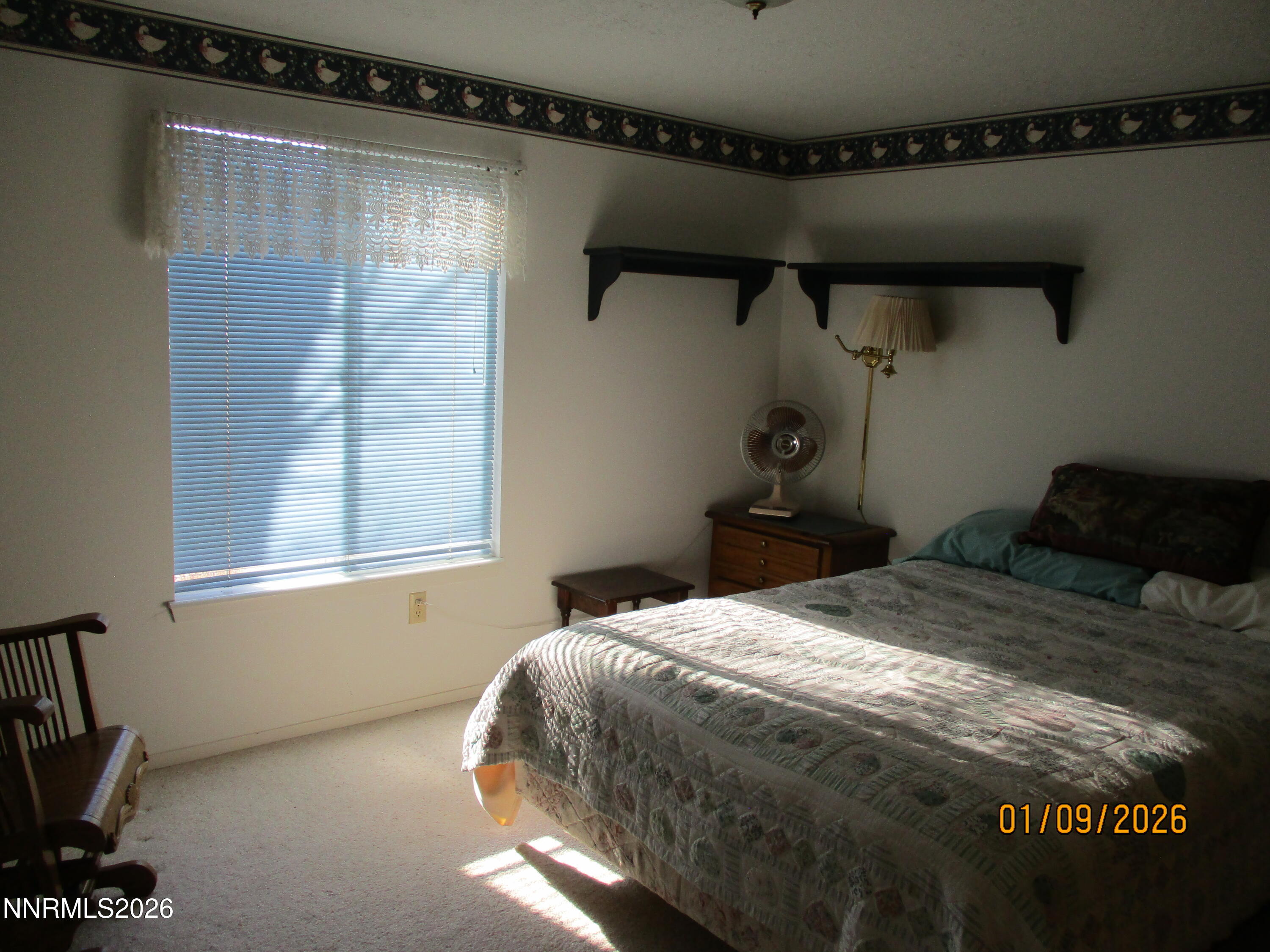 13405 Chimney Dam Road Paradise Valley, NV 89426 - Photo 27 of 90 a bedroom with a bed and a window
