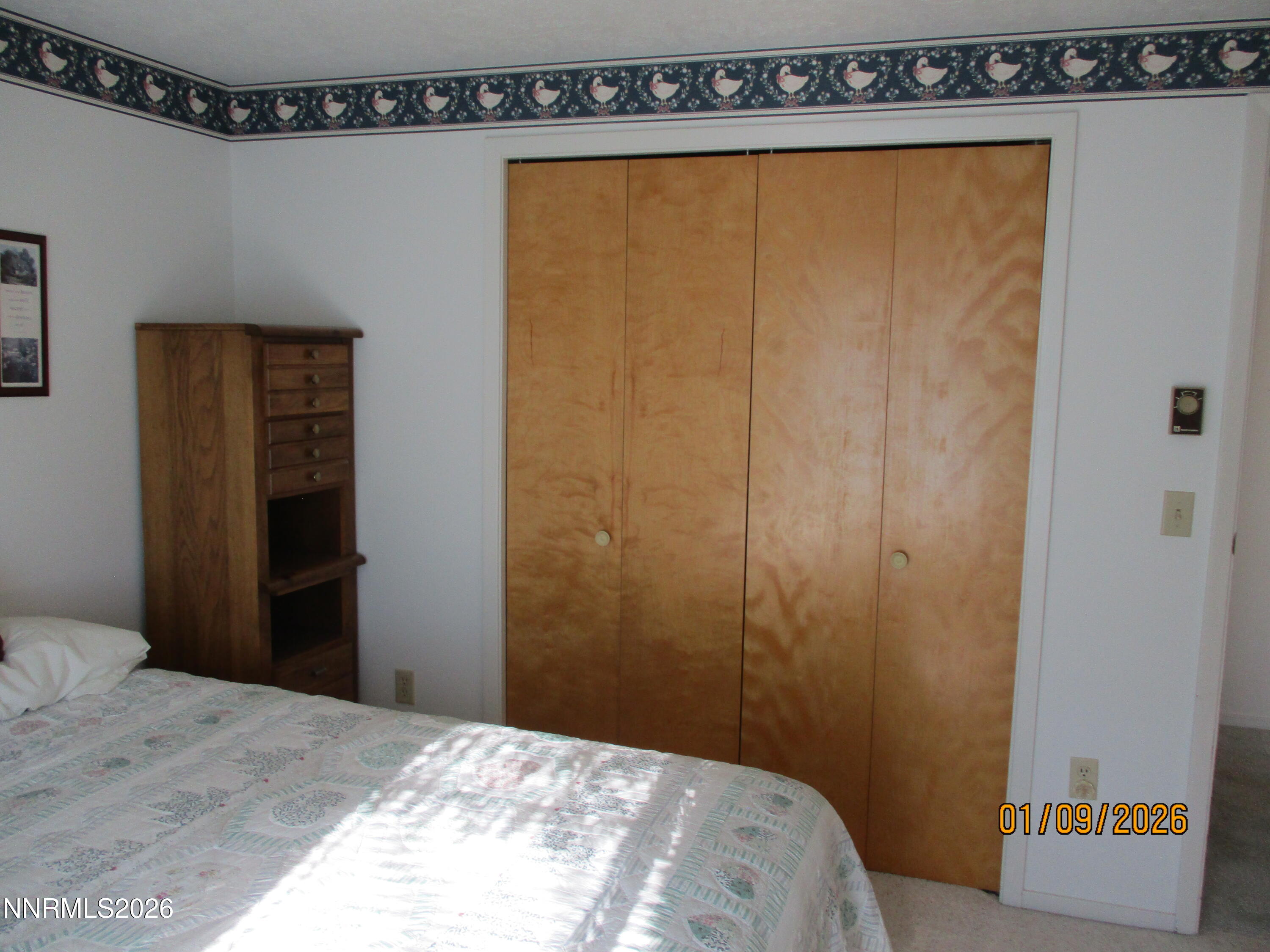 13405 Chimney Dam Road Paradise Valley, NV 89426 - Photo 28 of 90 a bedroom with a bed and a table in it