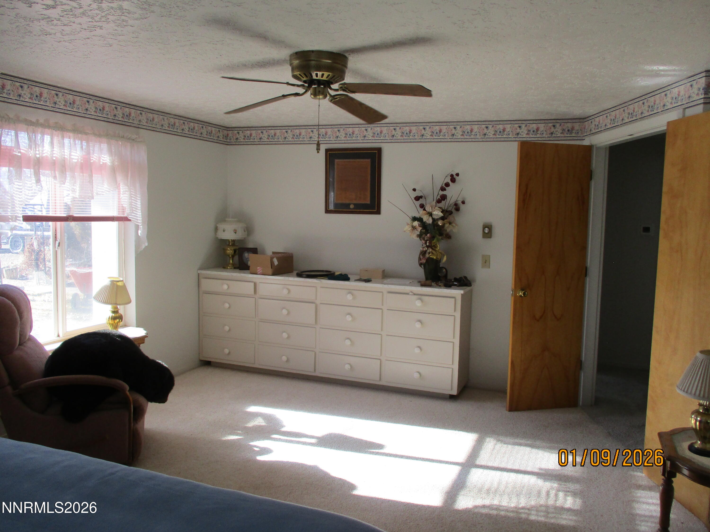13405 Chimney Dam Road Paradise Valley, NV 89426 - Photo 31 of 90 a living room with furniture and a window