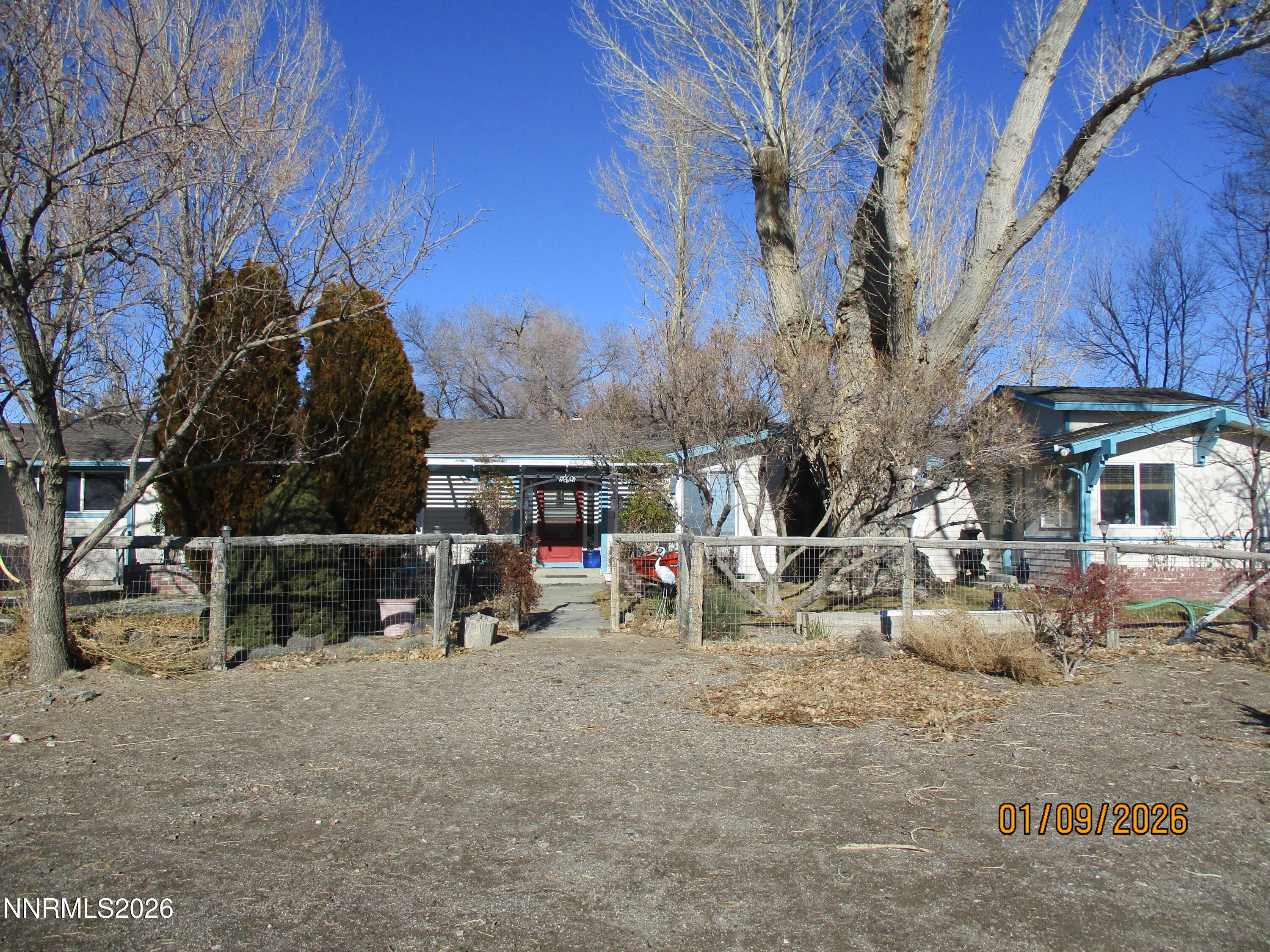 13405 Chimney Dam Road Paradise Valley, NV 89426 - Photo 4 of 90 a view of a chair and table in backyard