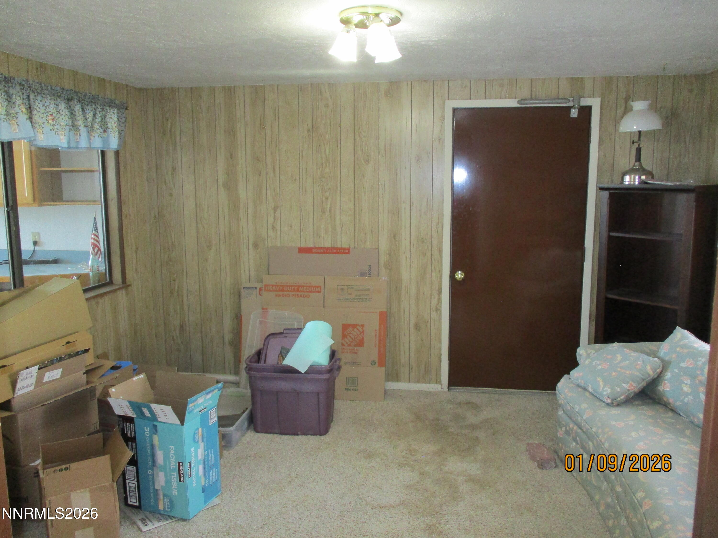 13405 Chimney Dam Road Paradise Valley, NV 89426 - Photo 52 of 90 a bedroom with a bed and a chandelier