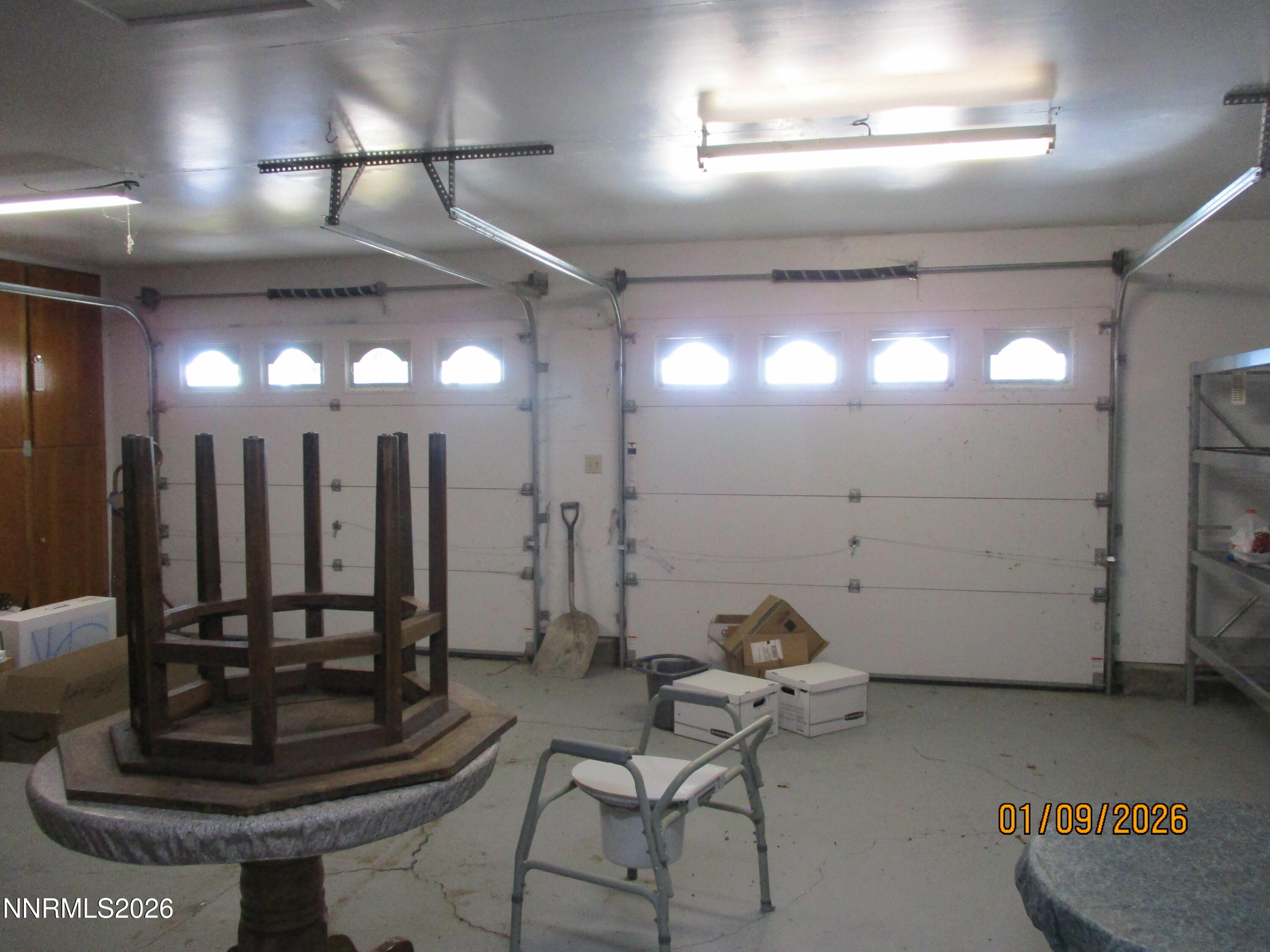 13405 Chimney Dam Road Paradise Valley, NV 89426 - Photo 59 of 90 a room with lots of chairs and mirrors