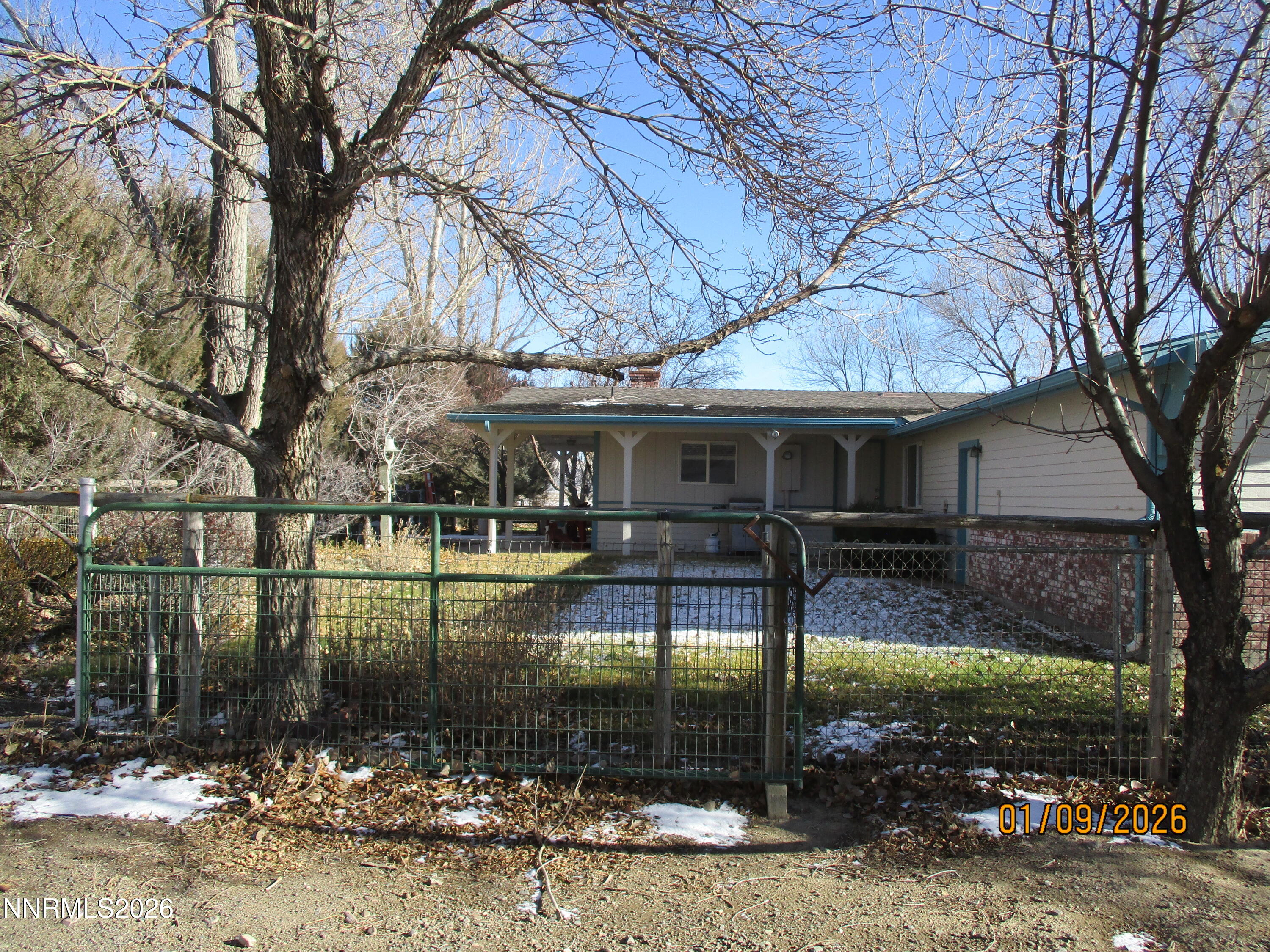 13405 Chimney Dam Road Paradise Valley, NV 89426 - Photo 6 of 90 a view of a house with backyard
