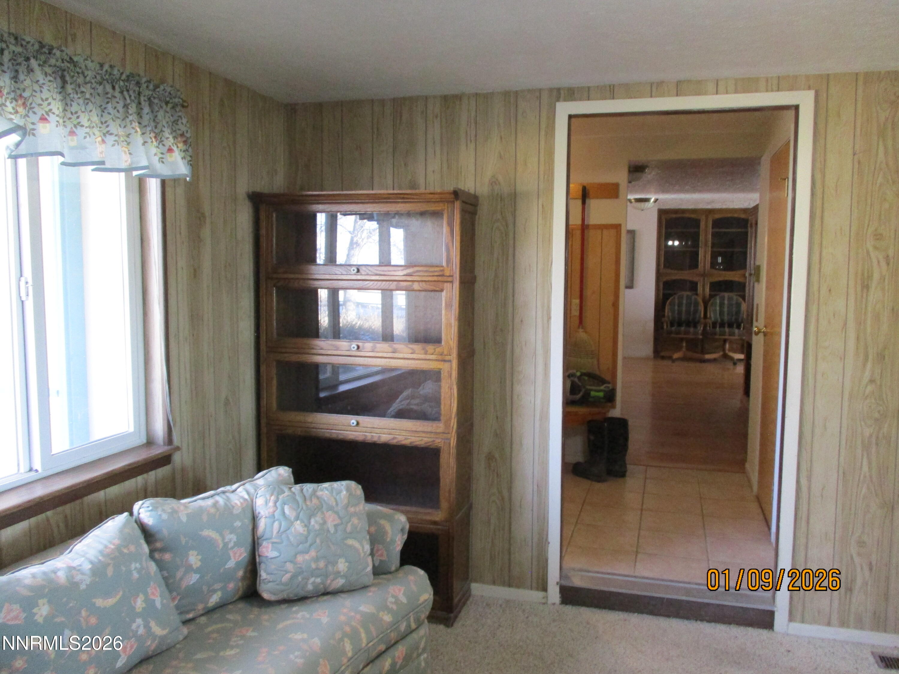 13405 Chimney Dam Road Paradise Valley, NV 89426 - Photo 61 of 90 a living room with furniture and a window