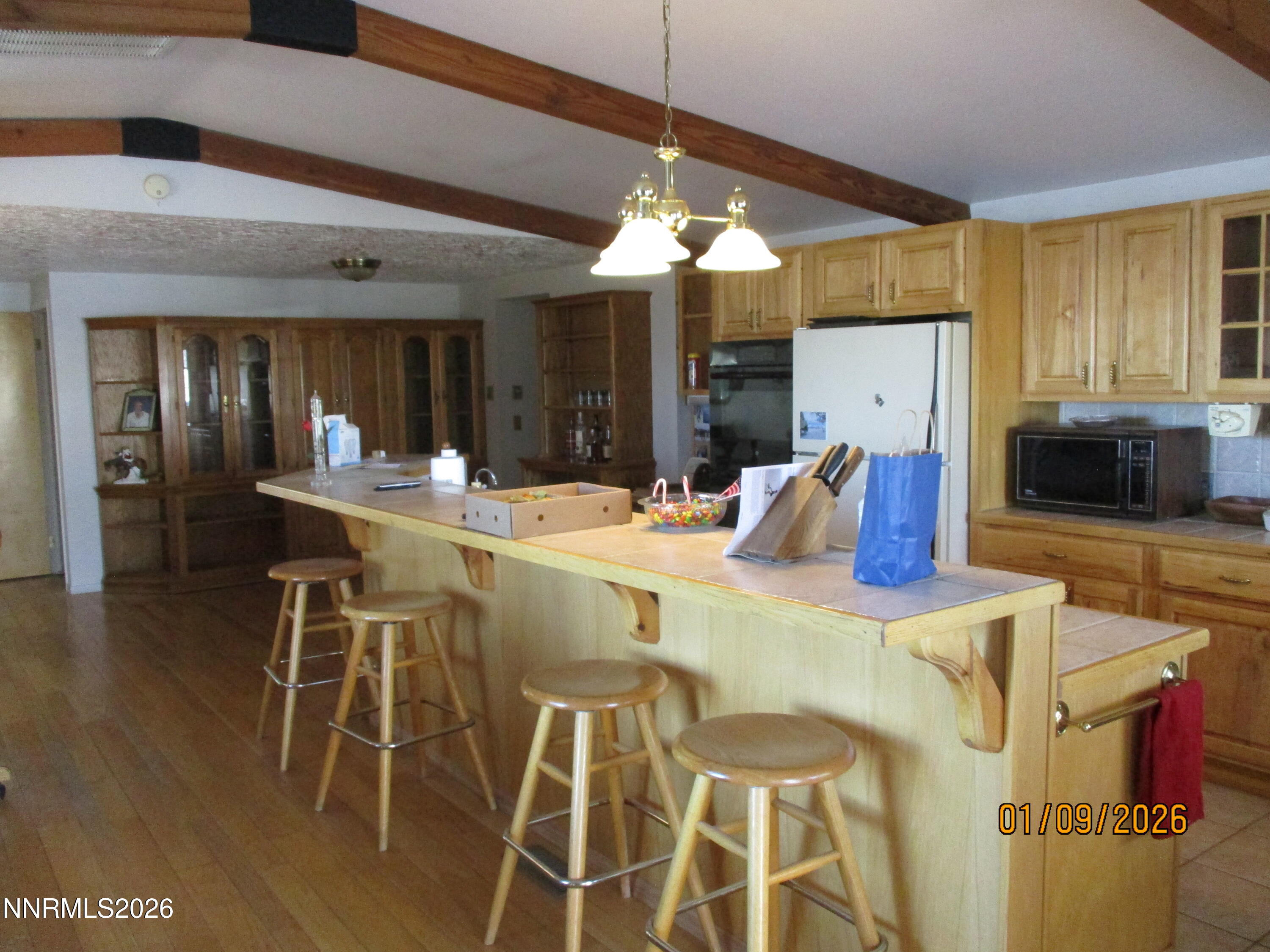 13405 Chimney Dam Road Paradise Valley, NV 89426 - Photo 66 of 90 a dining hall with stainless steel appliances kitchen island granite countertop a dining table and chairs