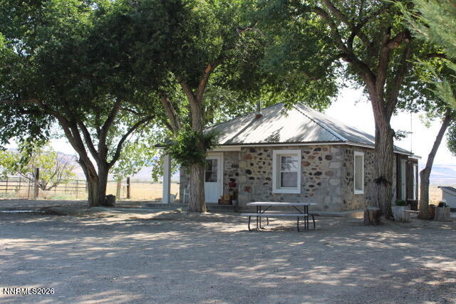 13405 Chimney Dam Road Paradise Valley, NV 89426 - Photo 7 of 90 a view of a house with a yard and tree s