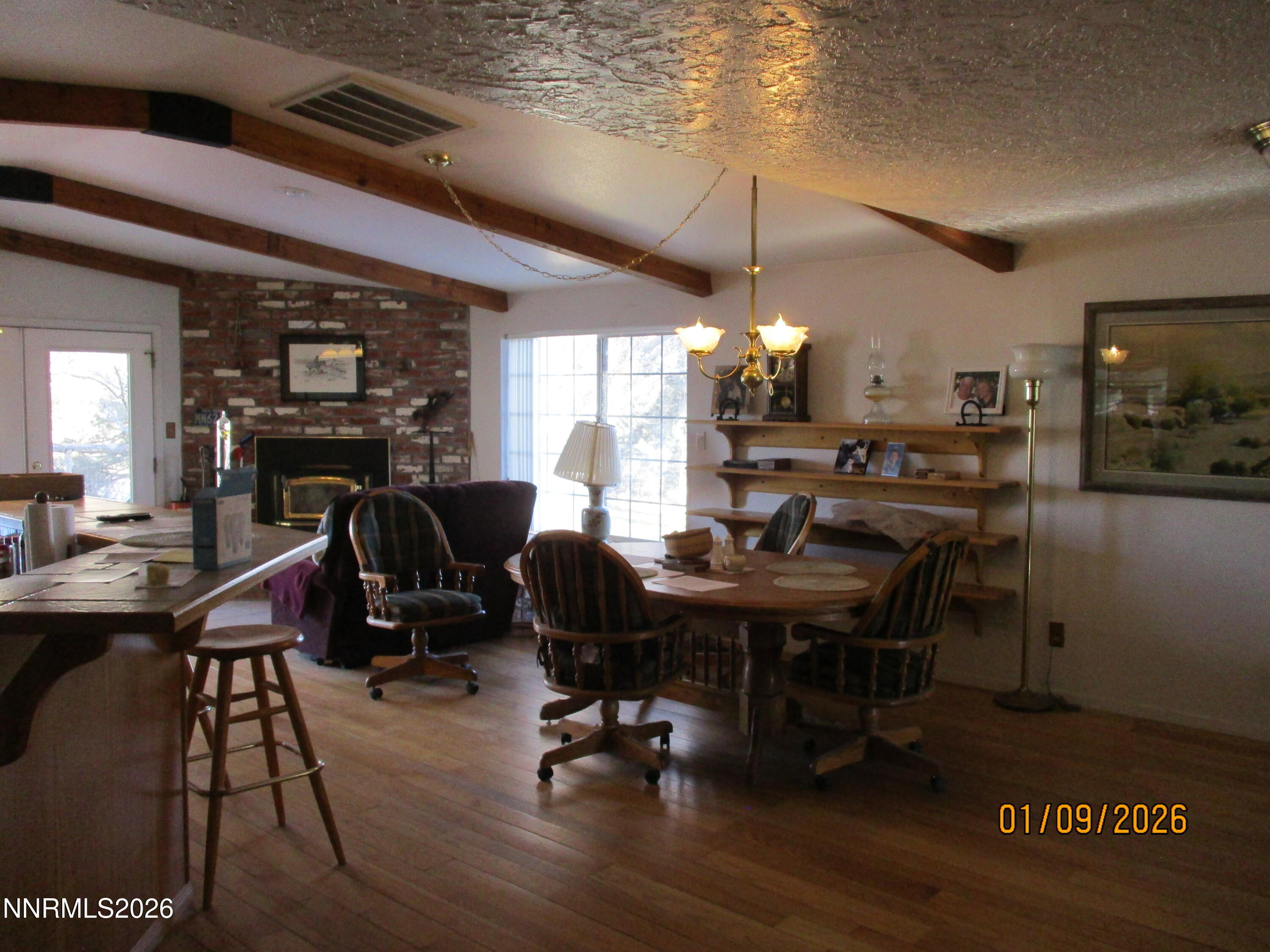 13405 Chimney Dam Road Paradise Valley, NV 89426 - Photo 73 of 90 a view of a dining room with furniture window and wooden floor