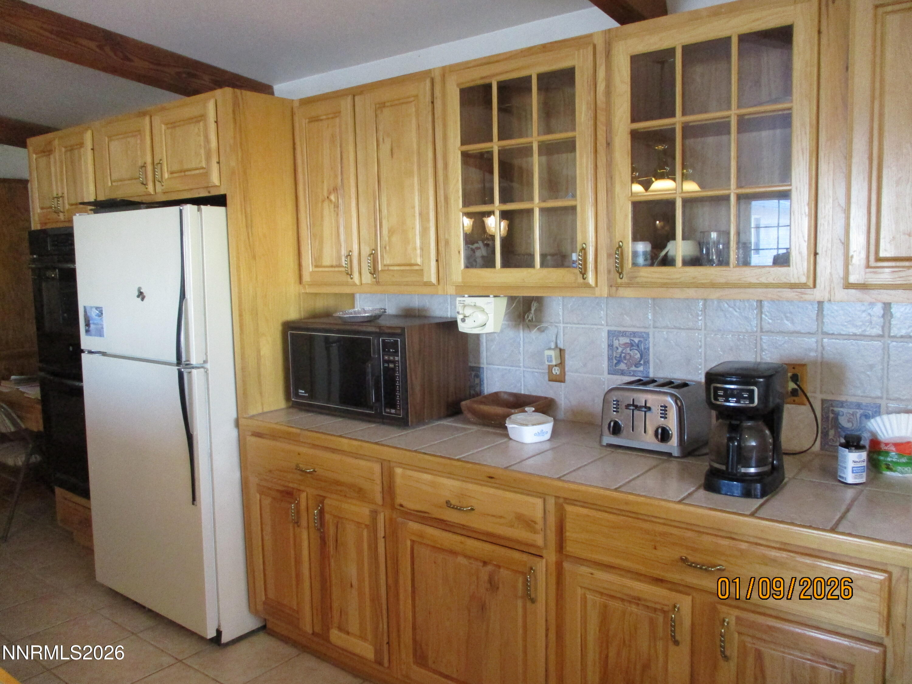 13405 Chimney Dam Road Paradise Valley, NV 89426 - Photo 77 of 90 a kitchen with stainless steel appliances granite countertop a refrigerator and a sink