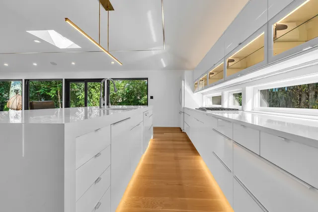 a view of a living room and kitchen