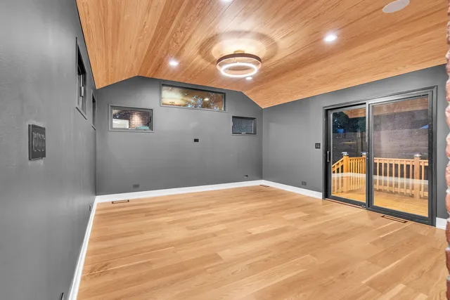 a view of an empty room and a window