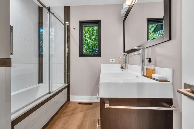 a bathroom with a sink and a mirror