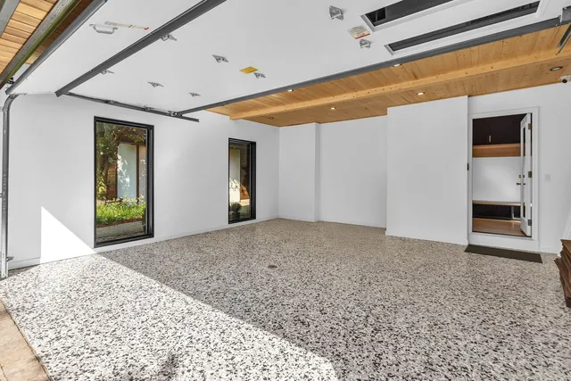 an outdoor living area with furniture and garden