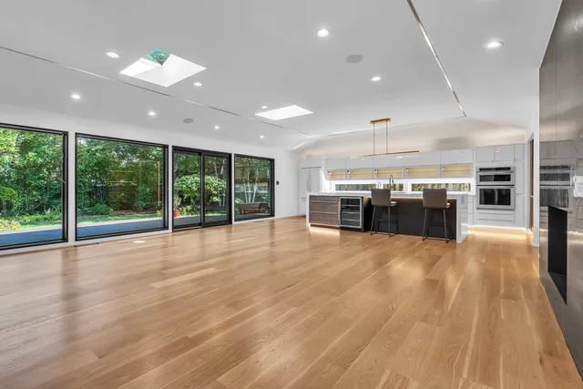 a view of kitchen and kitchen with large windows