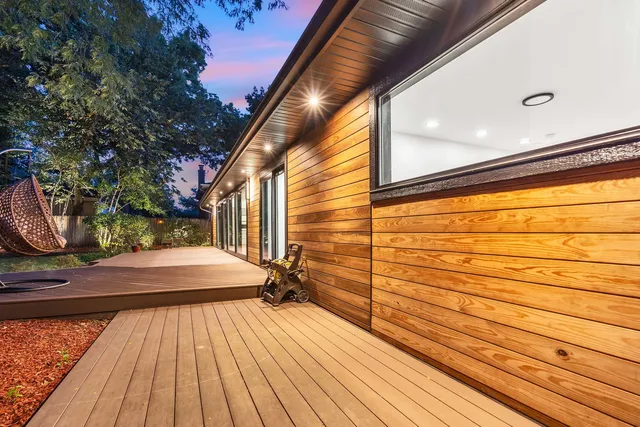 a view of a backyard with tree