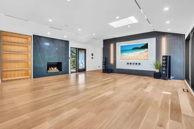 a view of empty room with a fireplace