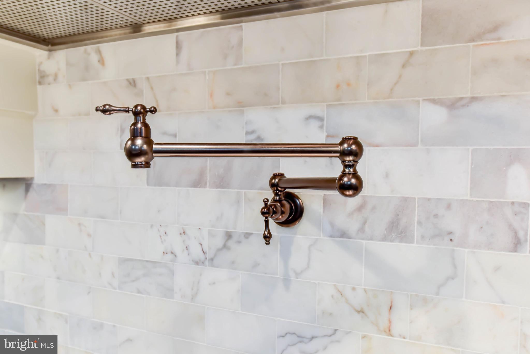 5531 30th Place Northwest Washington, DC 20015 - Photo 13 of 47 Marble back splash tile and bronze pot filler