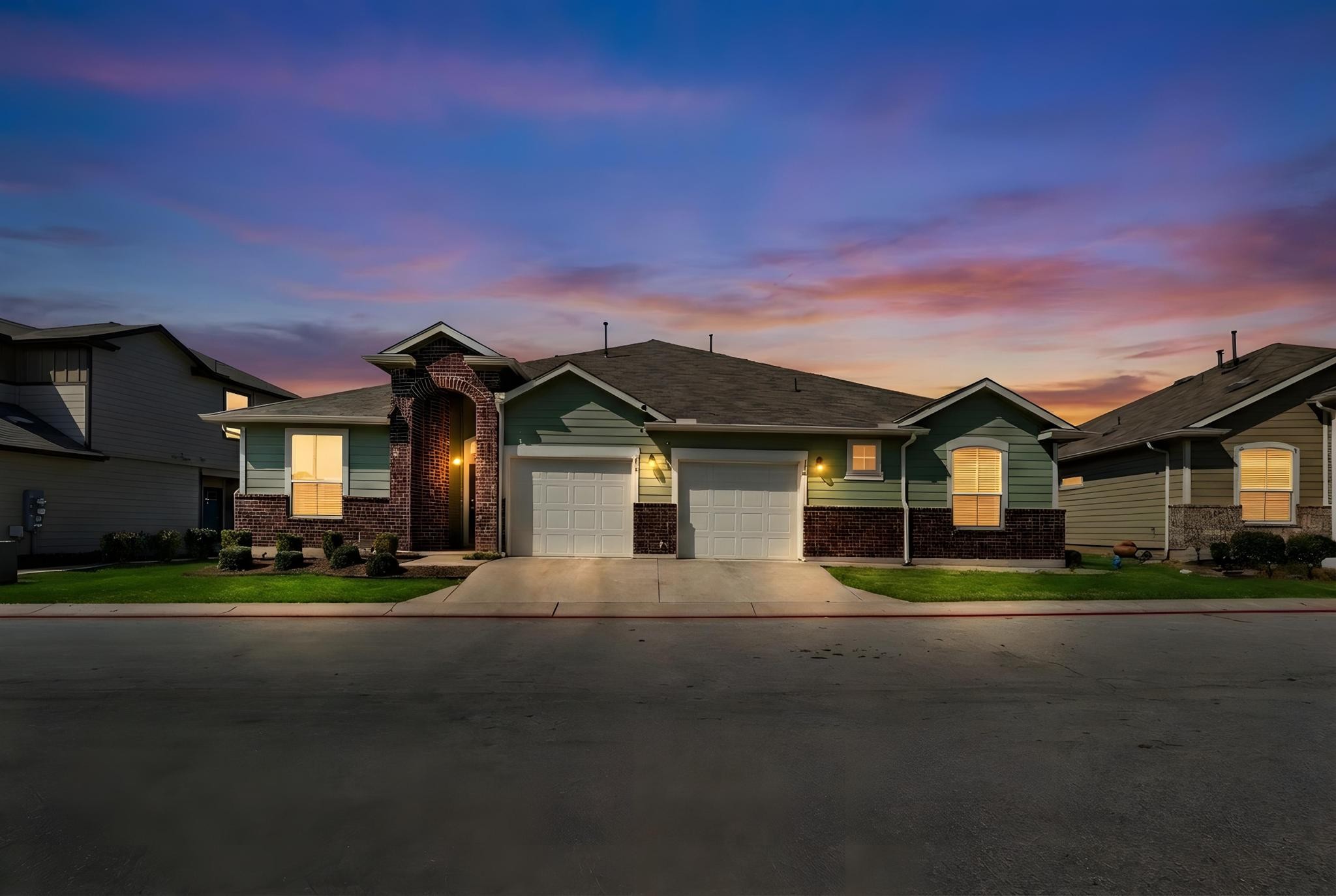 14409 Frankel Loop, Unit 33A Pflugerville, TX 78660 - Photo 24 of 28 a front view of a house with a yard