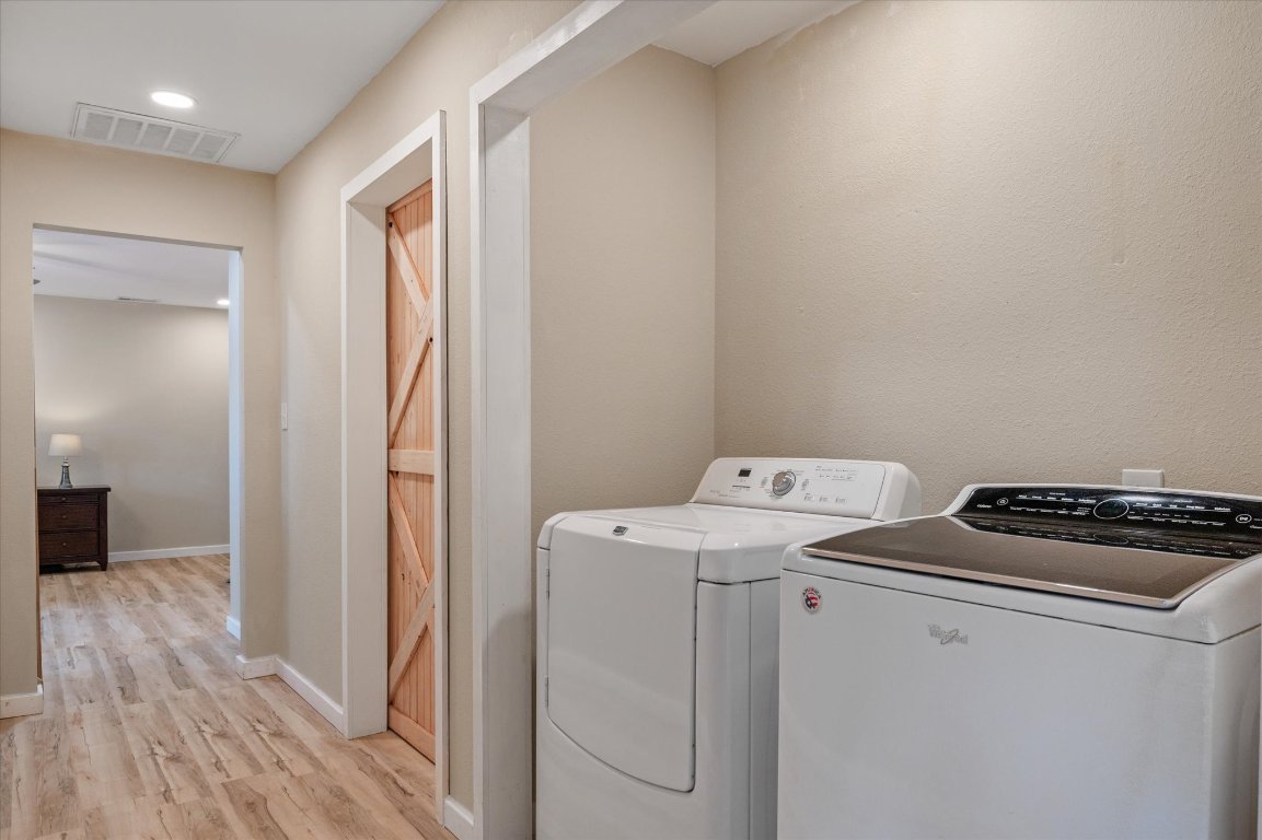 215 Go Away Road Blanco, TX 78606 - Photo 16 of 29 a view of storage and utility room with washer and dryer