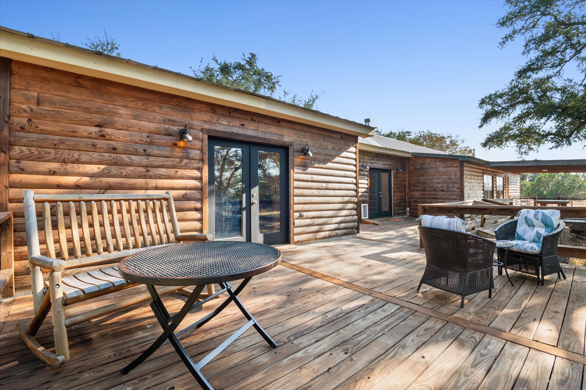 215 Go Away Road Blanco, TX 78606 - Photo 20 of 30 Backyard patio deck goes the whole length of the back of the home. The address might be Go Away Road, but it’s the kind of place you’ll want to call home forever.