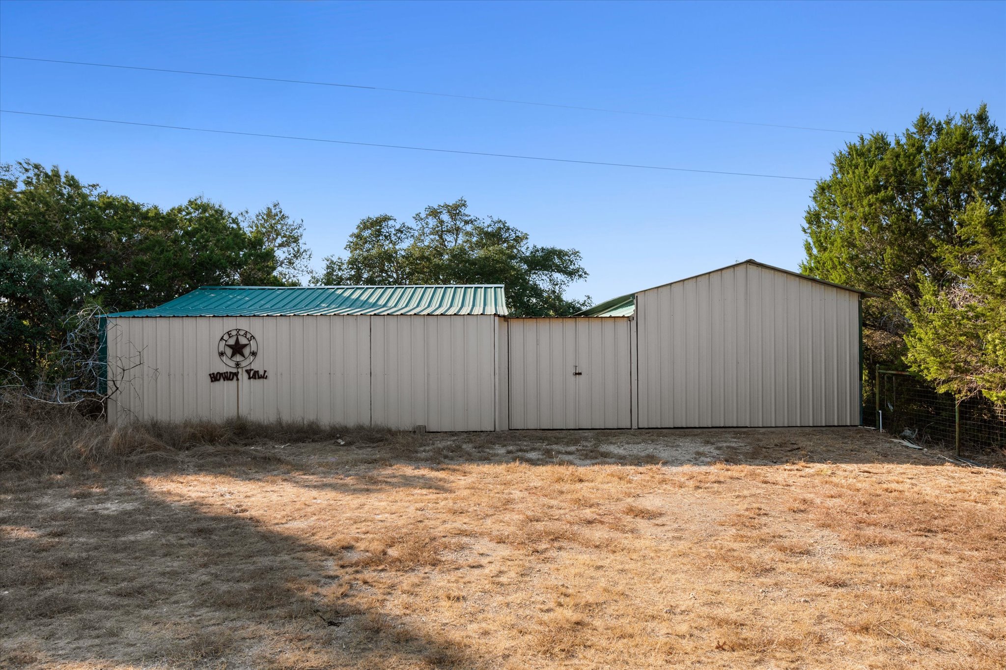 215 Go Away Road Blanco, TX 78606 - Photo 25 of 30 Large 1,520 sq ft barn perfect for storage, projects, or livestock — plus two additional storage sheds.