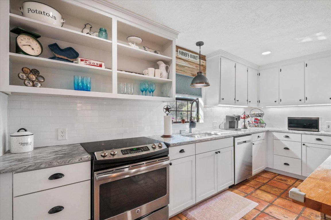 215 Go Away Road Blanco, TX 78606 - Photo 8 of 29 a kitchen with cabinets appliances and a sink