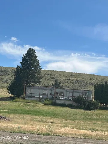 a view of a swimming pool with a yard