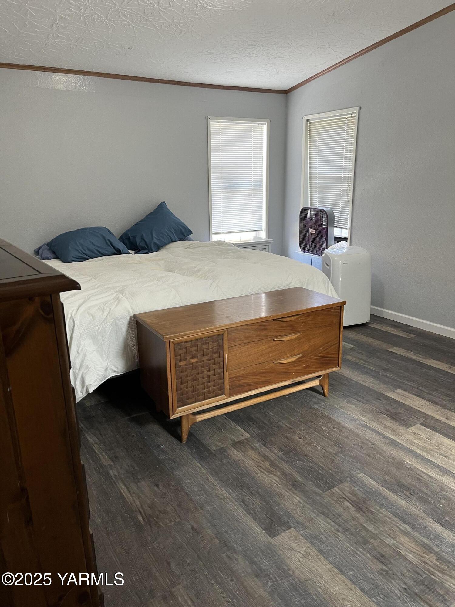 14190 North Wenas Road Selah, WA 98942 - Photo 45 of 62 a bedroom with a bed and a night stand