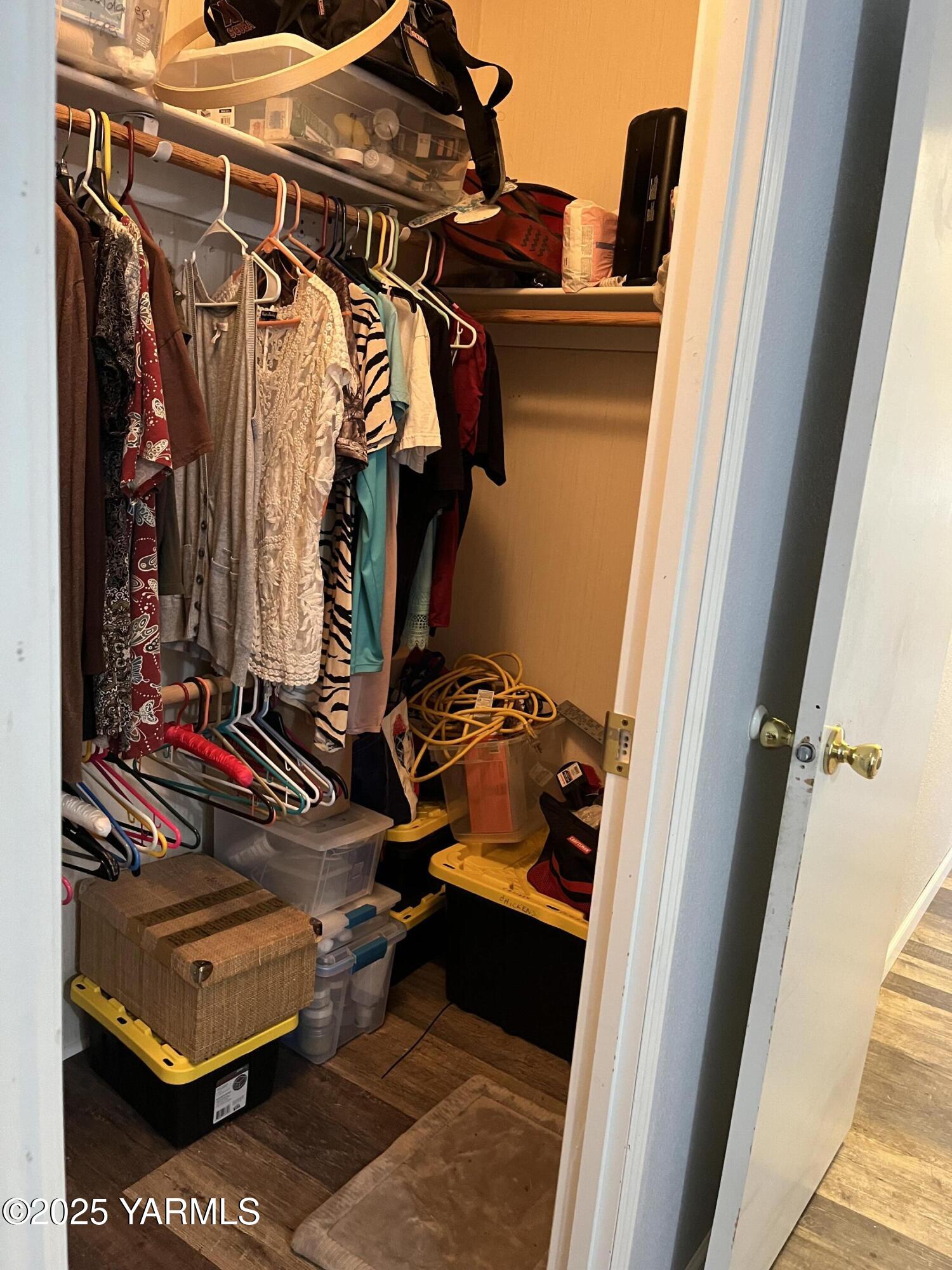 14190 North Wenas Road Selah, WA 98942 - Photo 47 of 62 a view of walk in closet with clothes and shoes